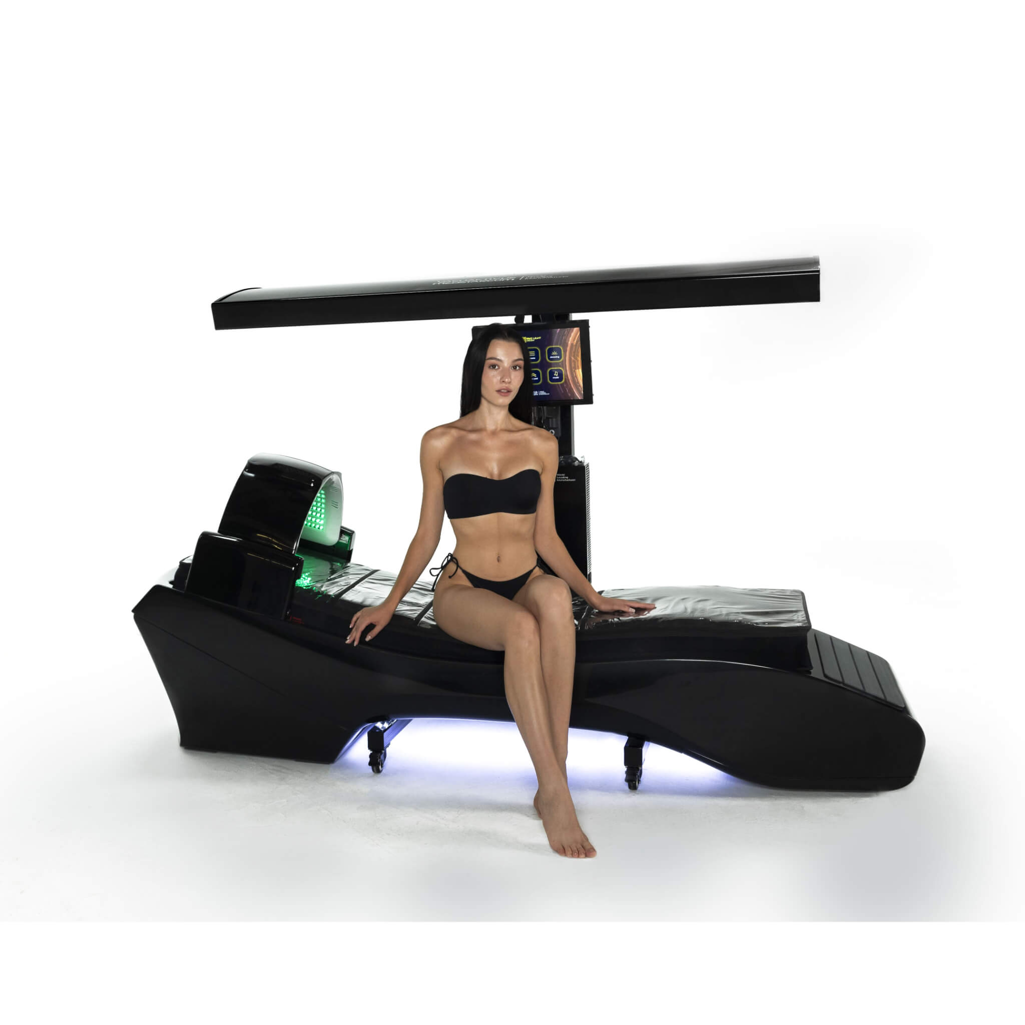 Cryonick InfraCouch Red Light Therapy Bed, woman in a black bikini sitting with a white background.