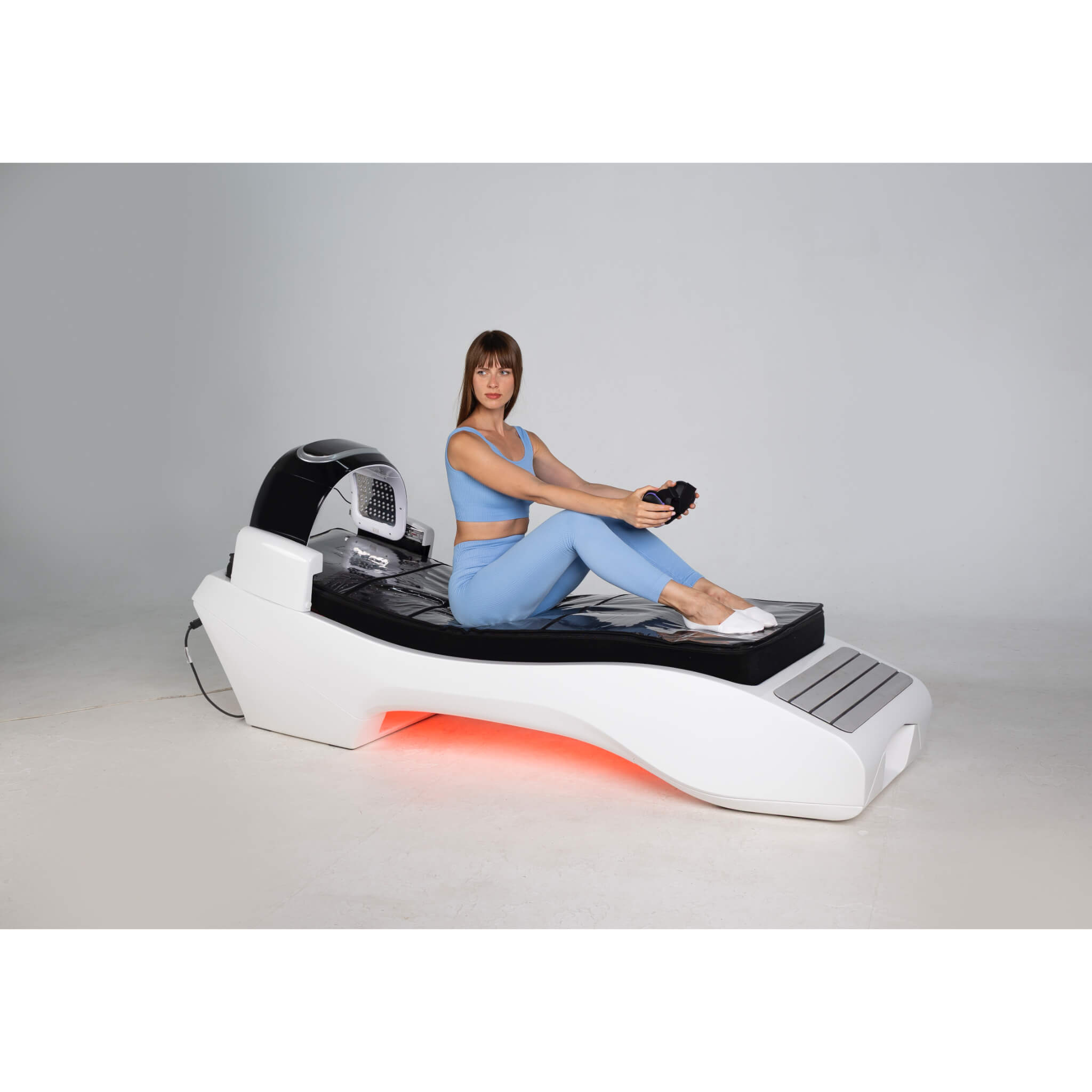 Cryonick InfraCouch Red Light Therapy Bed white with woman siting