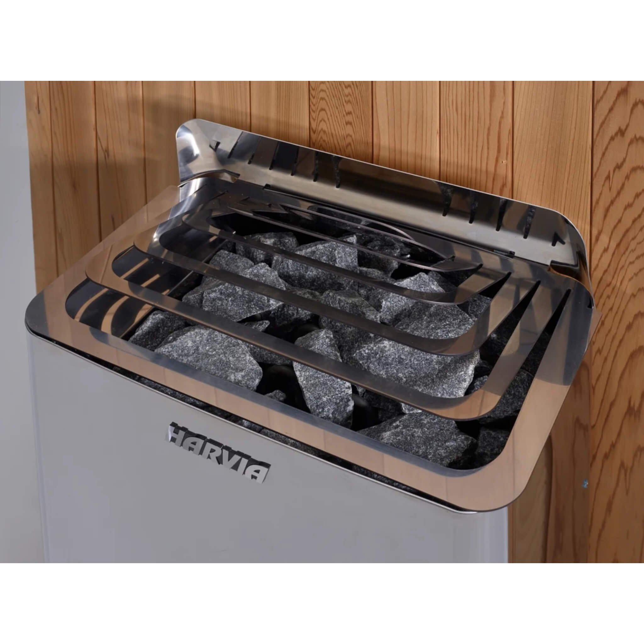 Close up of the Harvia stove stone tray inside the Arosa Barrel Sauna showing the sauna stones