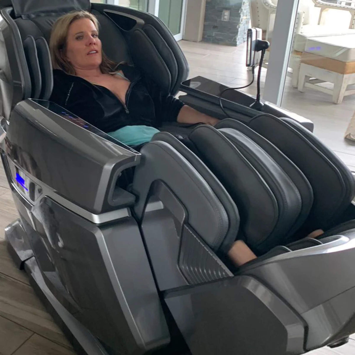 Person relaxing in the Dr. Fuji FJ-8500 Plus AI 4D luxury massage chair.