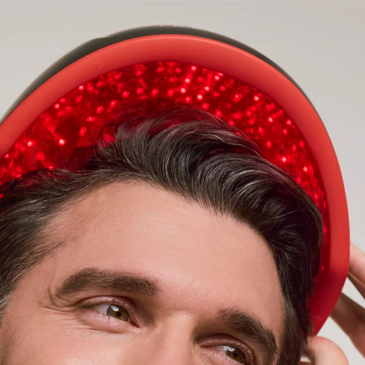 Close-up of a mature man wearing the iRESTORE Elite Hair Growth System