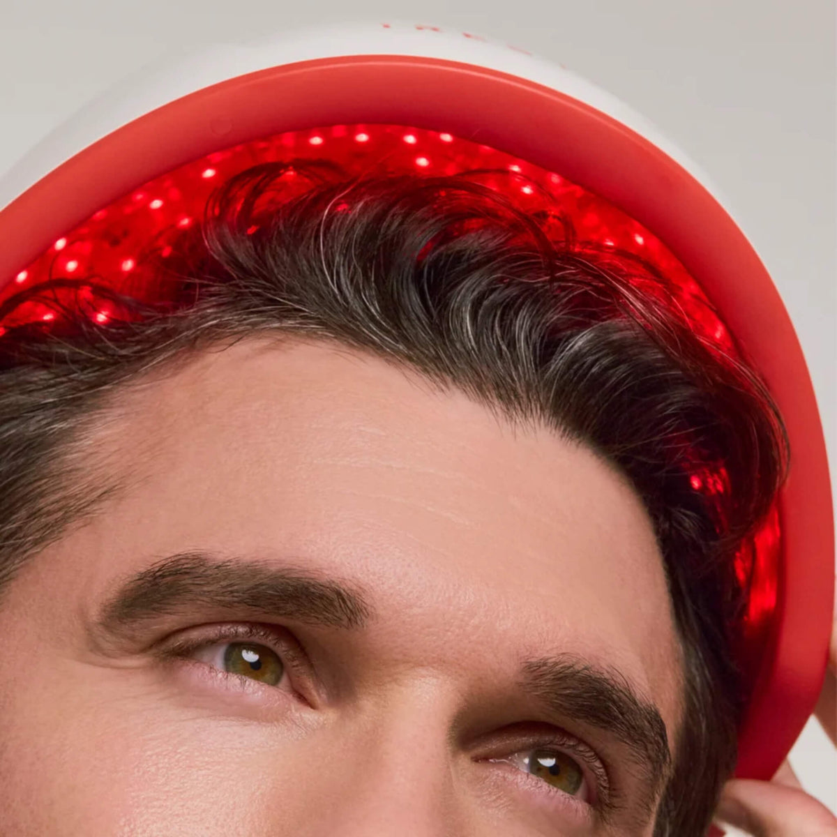 Close-up of a mature man wearing the iRESTORE Professional Hair Growth System