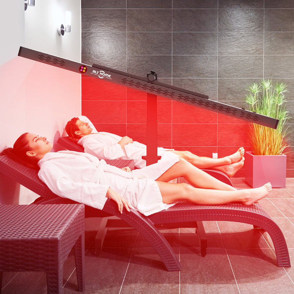 Woman lying on a lounge chair under the RLT Home Total Spectrum ELITE Red Light Therapy Device set horizontal