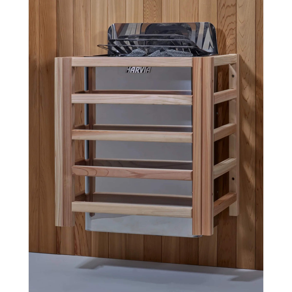 Harvia wall-mounted stove installed with wood heater guard on the Vorarlberg sauna