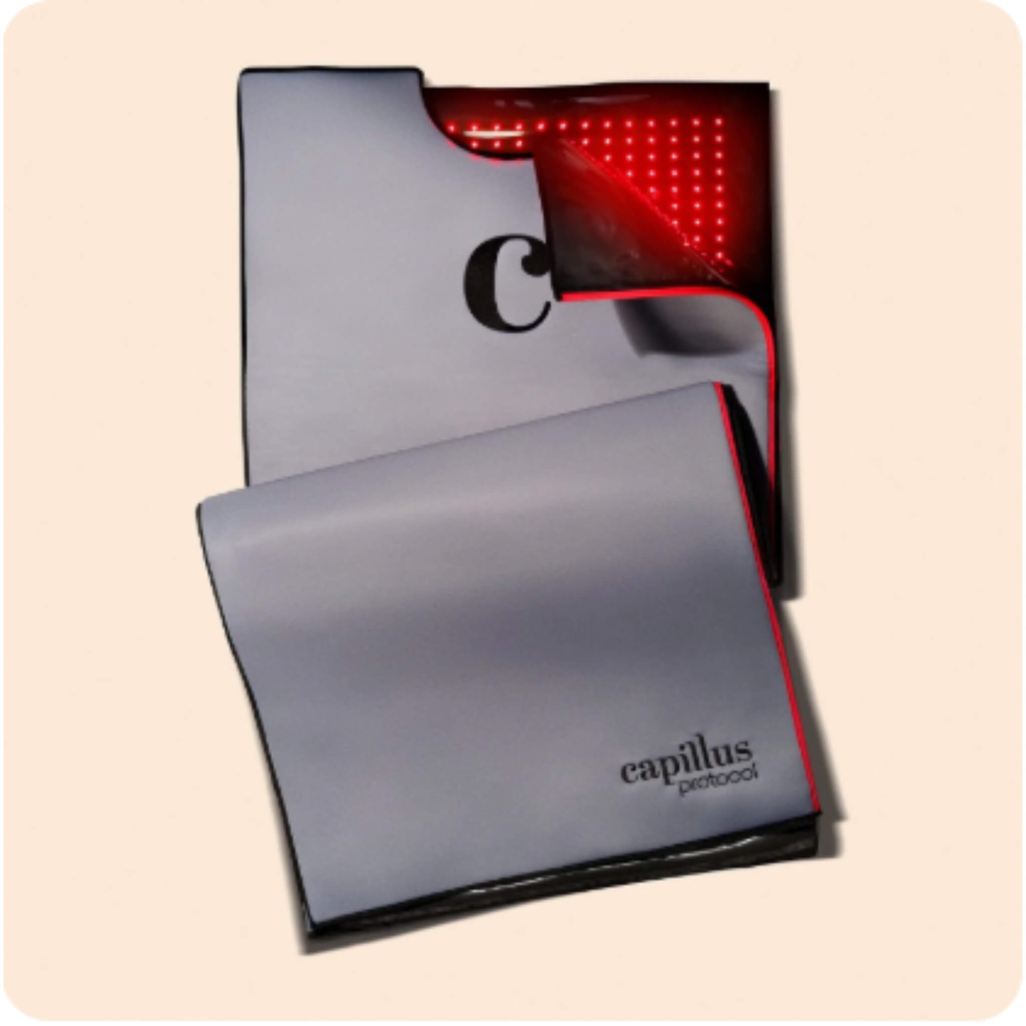 Capillus Healing Pod shown folded closed and open revealing high-density red light LED panel interior