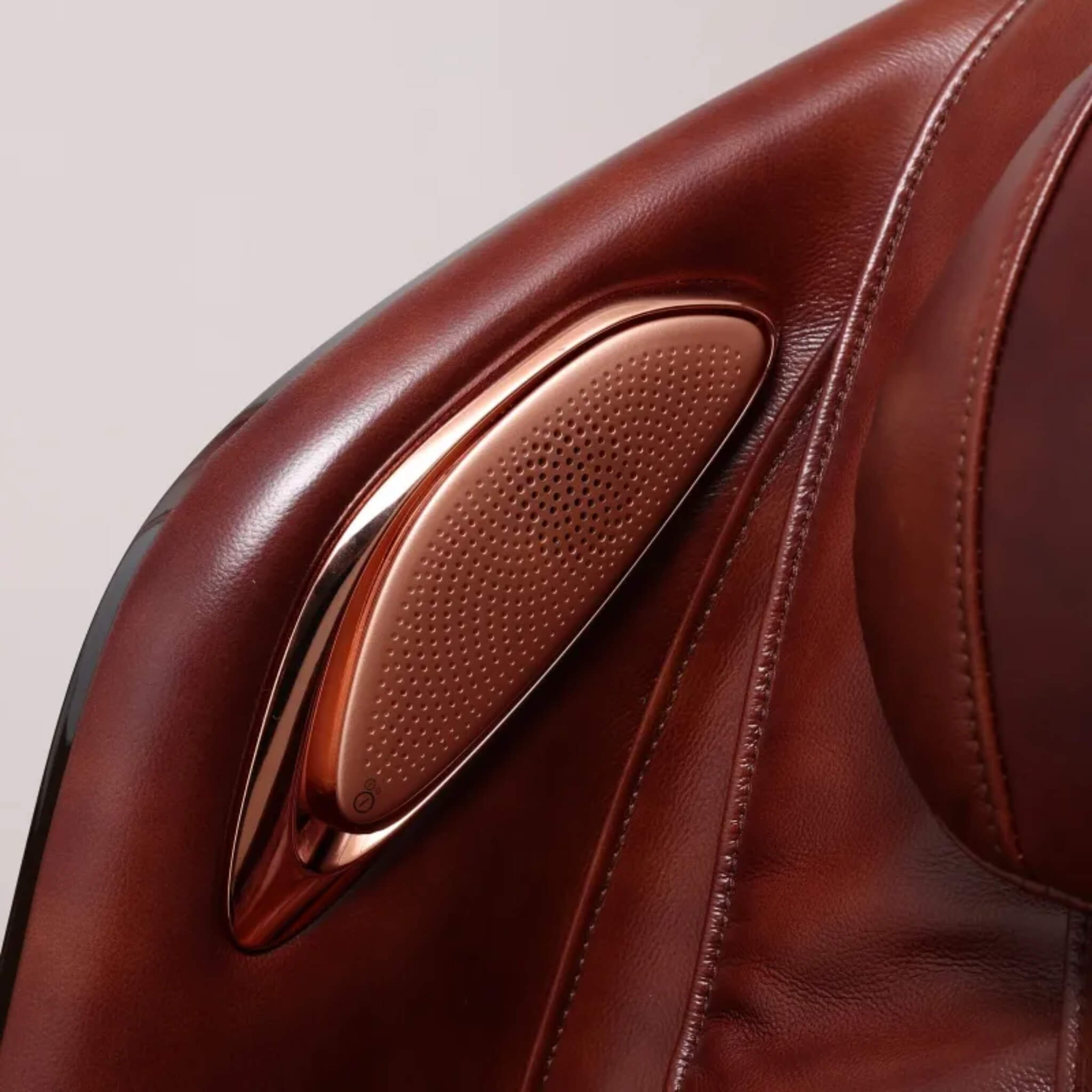 Close-up of the built-in Bluetooth speaker on the DR.BOSS FJ-2025 in burgundy leather