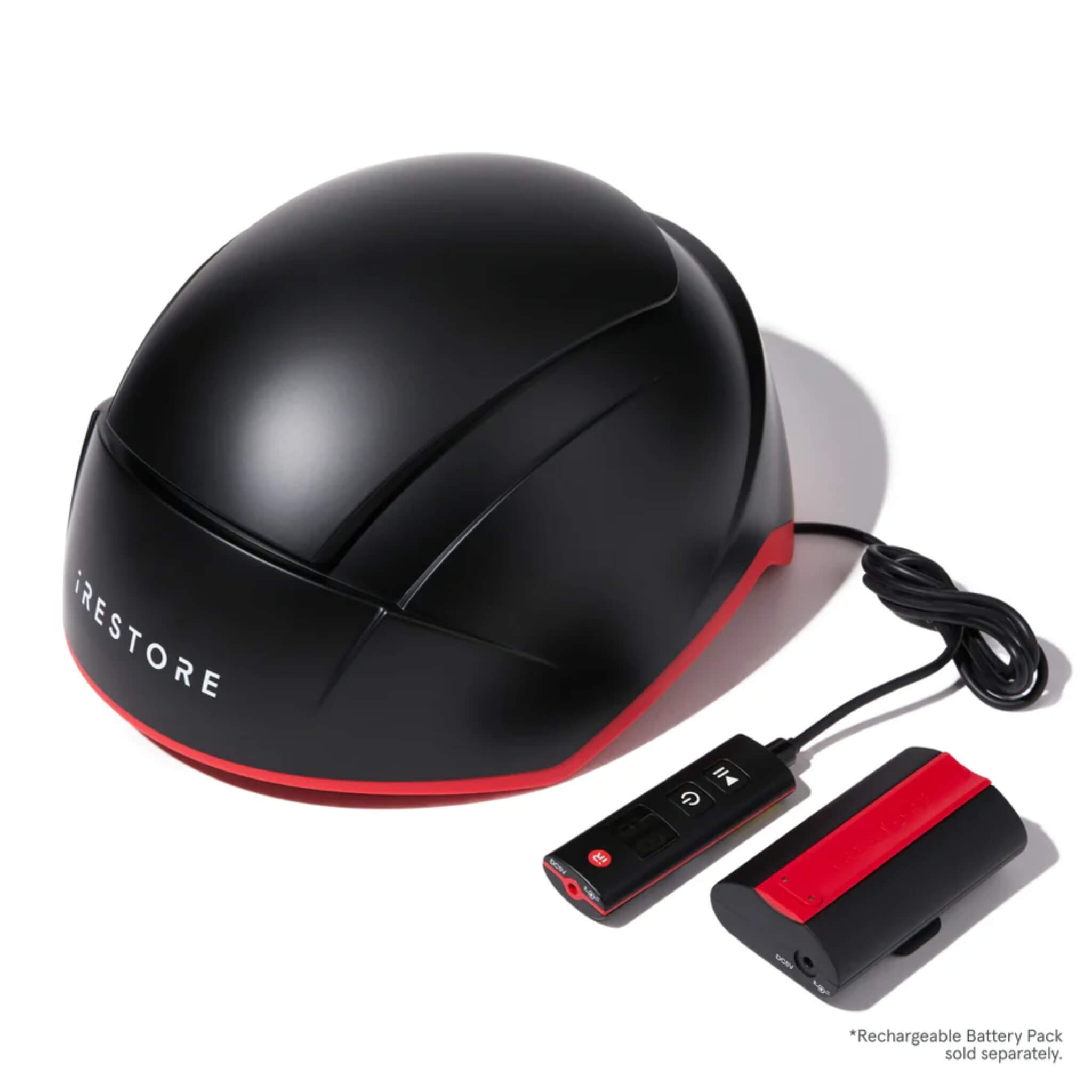 iRESTORE Elite hair growth system with rechargeable battery pack and controller on white background