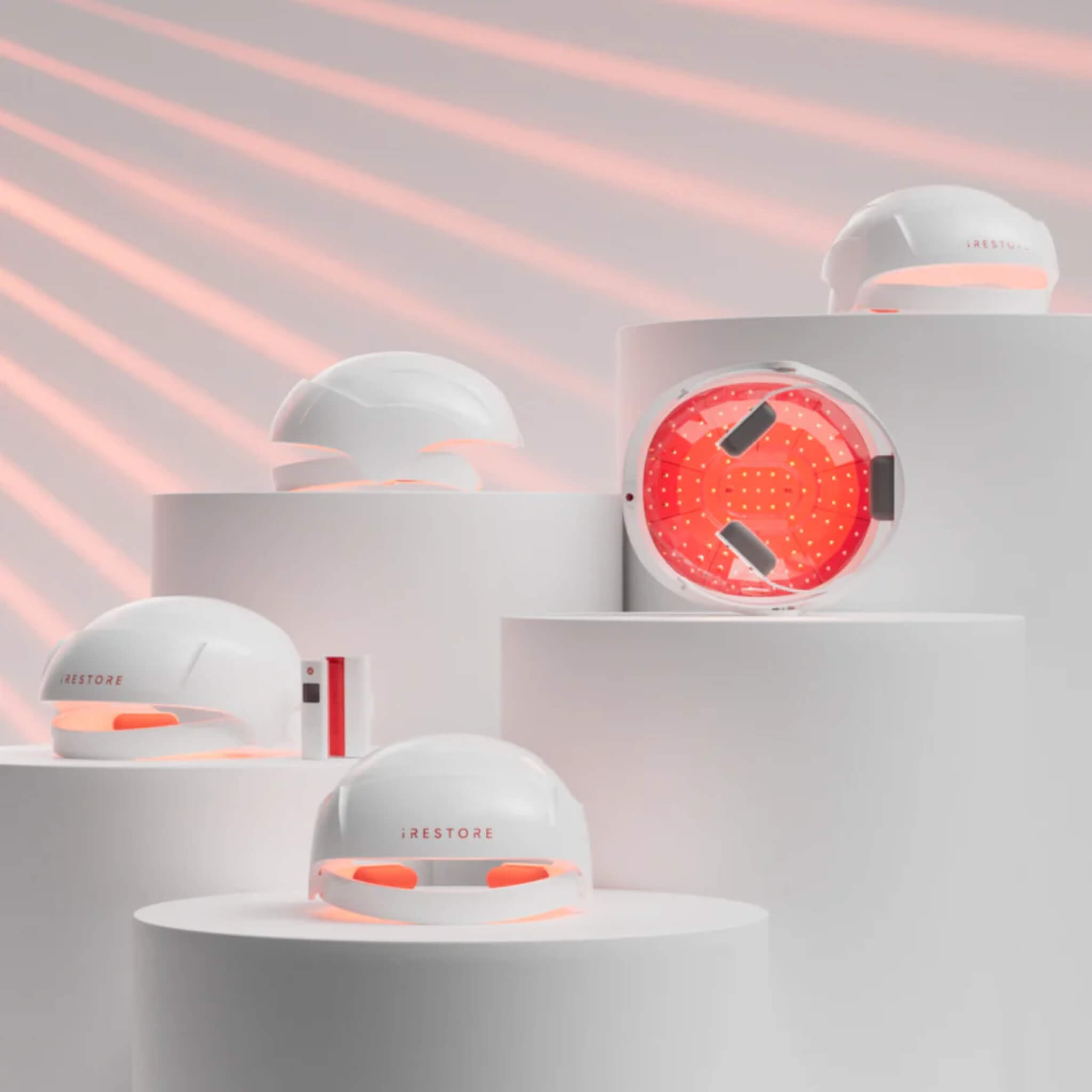 iRESTORE Essential laser and LED panel close-up shown from multiple angles with red light illuminated