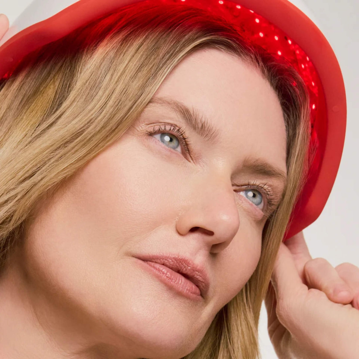 Close-up of a woman wearing the iRESTORE Professional Hair Growth System