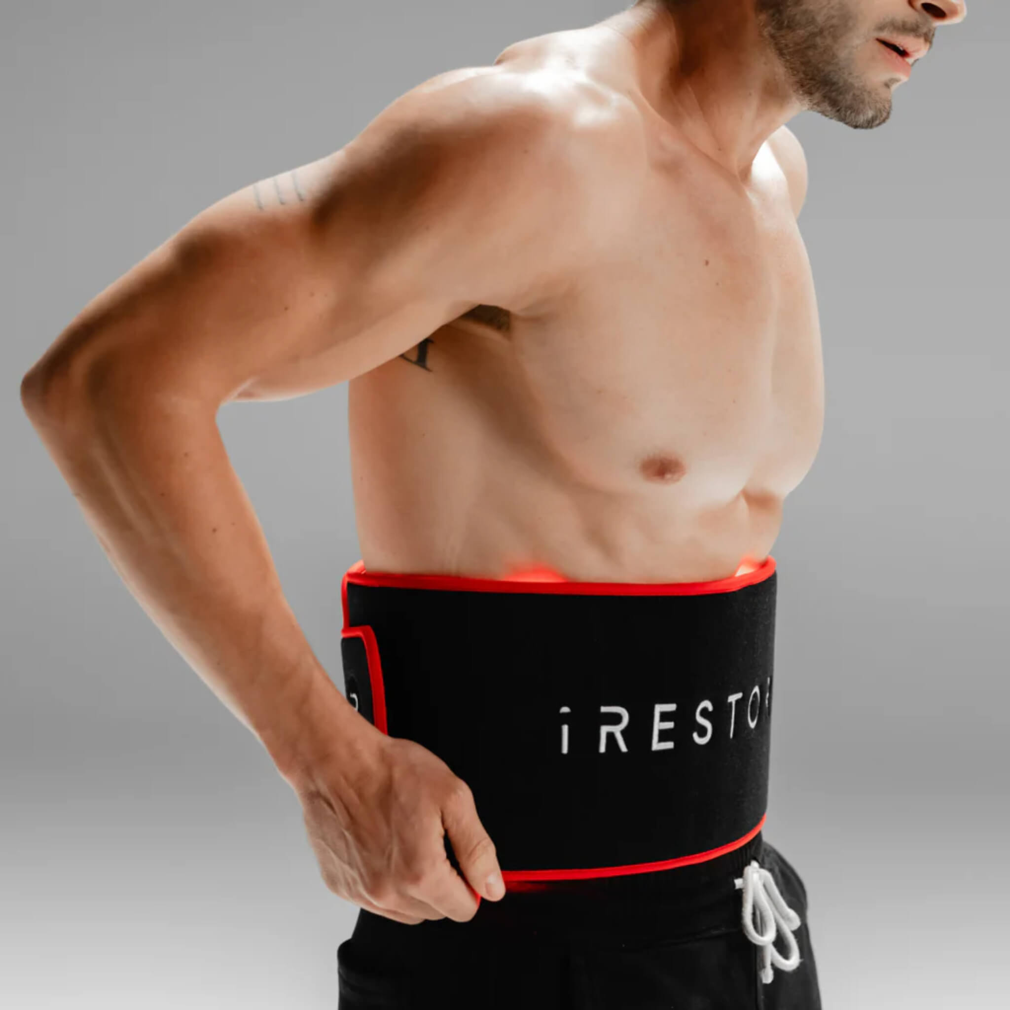 Man wearing the iRESTORE Sculpt LED Belt around his waist