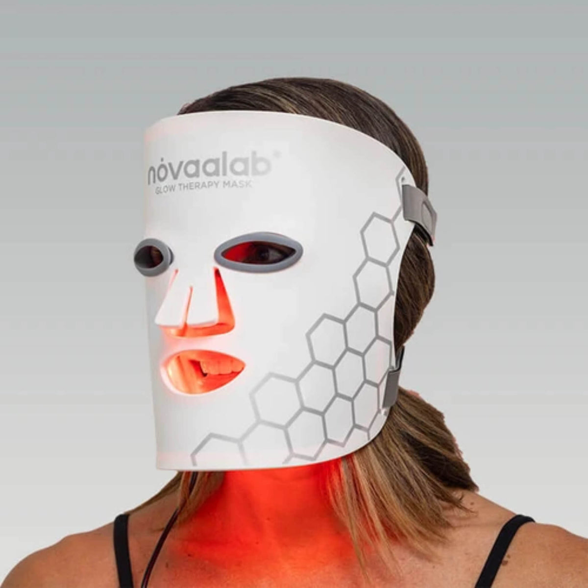 Woman wearing the NovaaLab Novaa Glow Therapy Mask showing the full face fit and eye shield