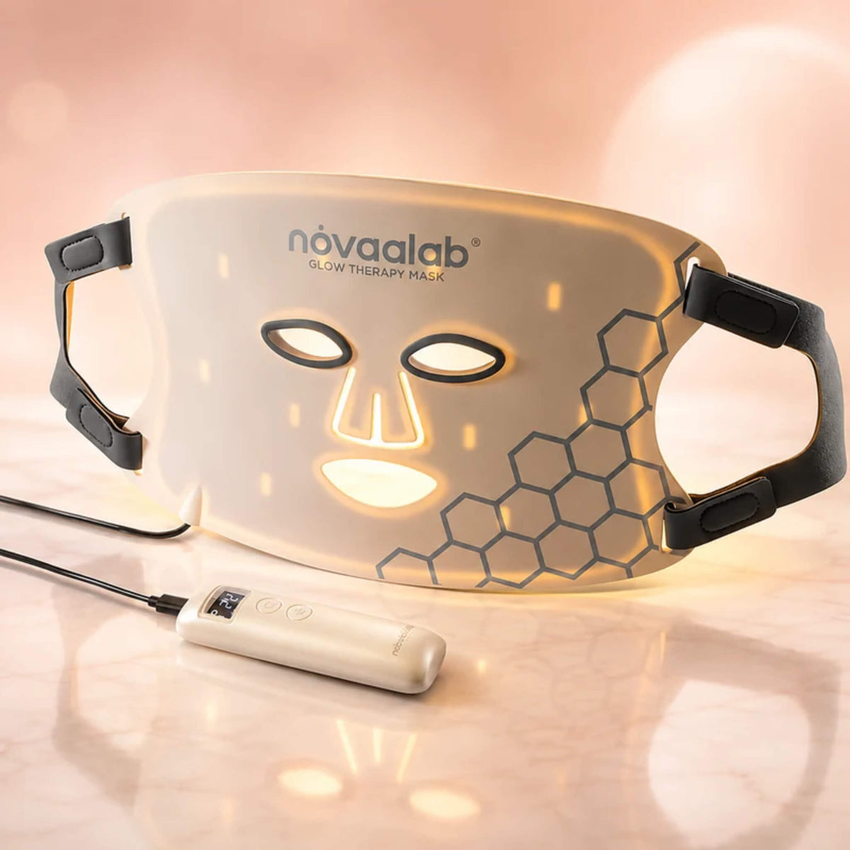 NovaaLab Novaa Glow Therapy Mask in yellow light mode with elastic bands and controller
