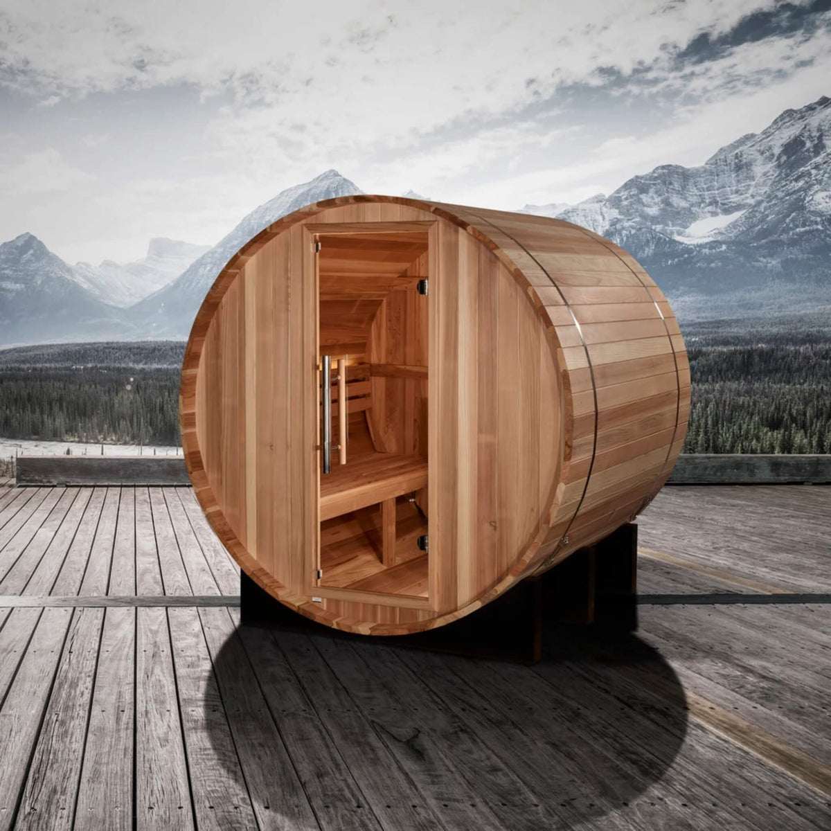 St. Moritz 2 Person Barrel Sauna on an outdoor deck with a mountain view